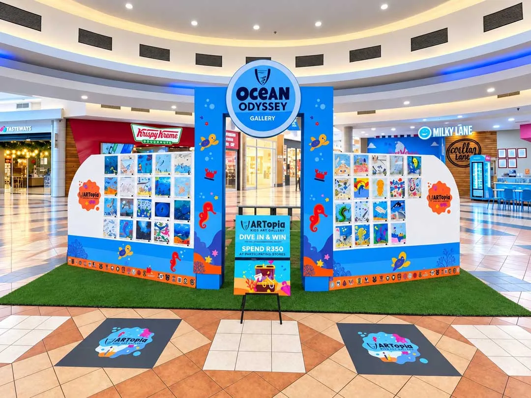 Children's ocean-themed artwork fills the ARTopia Ocean Odyssey Gallery at Liberty Midlands Mall.