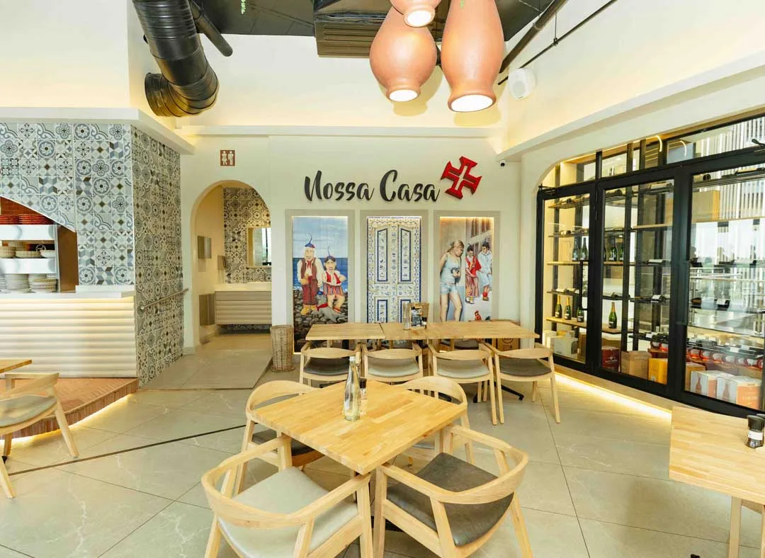 Nossa Casa restaurant interior featuring Portuguese-inspired decor, patterned tiles and wooden dining tables at The View.